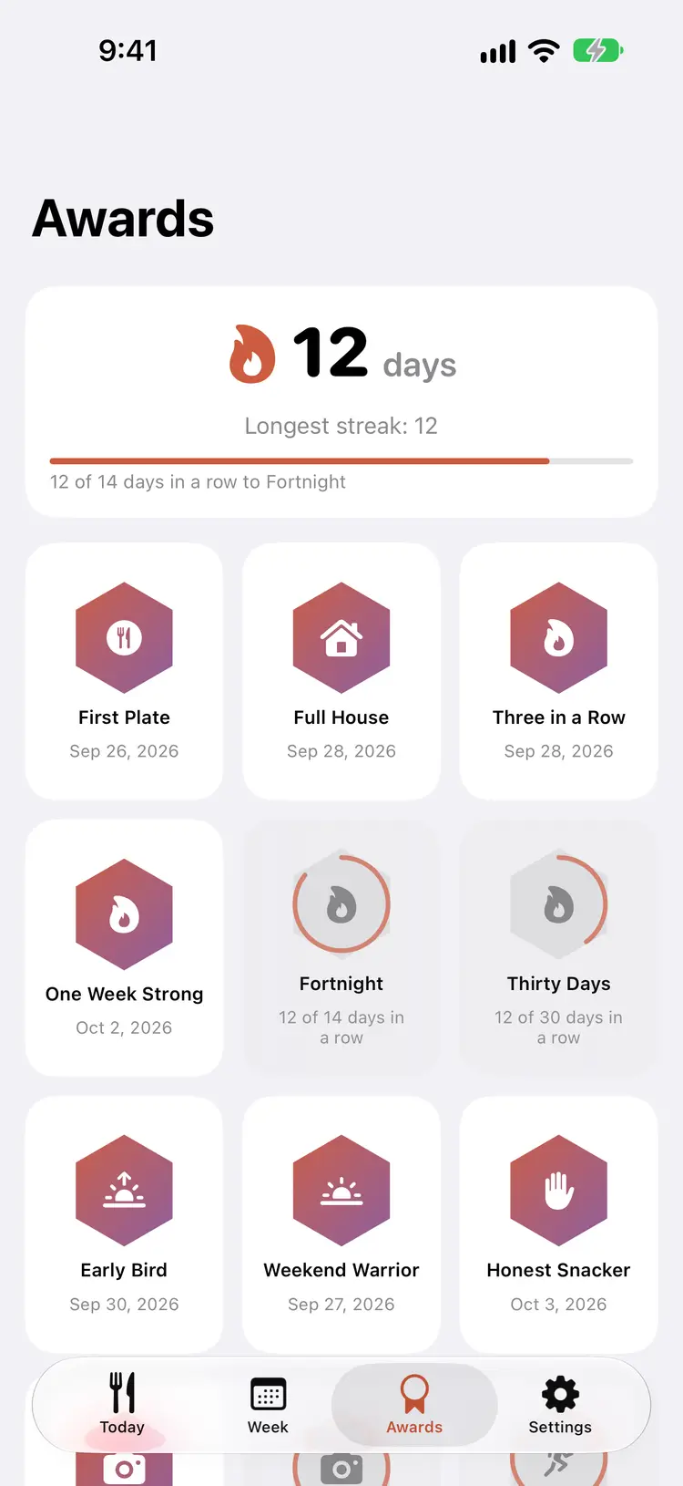 The Awards screen with a 12-day streak and earned badges